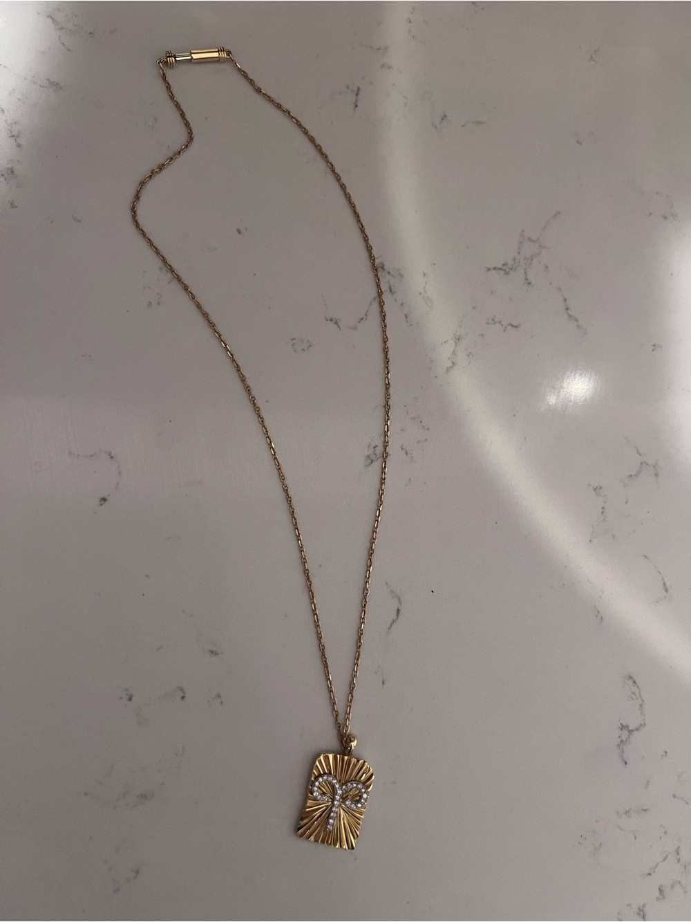 Gold-Tone Radiant Rectangle Pendant Necklace with Crystal Detail